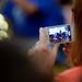 An audience member video tapes as the band performs in the gym at Tappan Middle School on Wednesday, May 29, 2013. Melanie Maxwell | AnnArbor.com